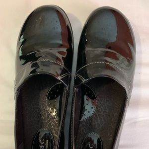 Women’s black patent leather clogs